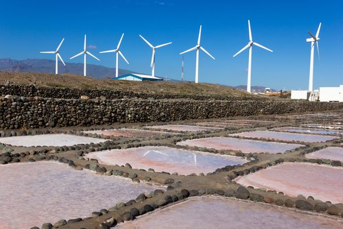 pink-salt-mines-with-wind-turbines-factory-on-background-in-pozo-izquierdo-gran-canaria
