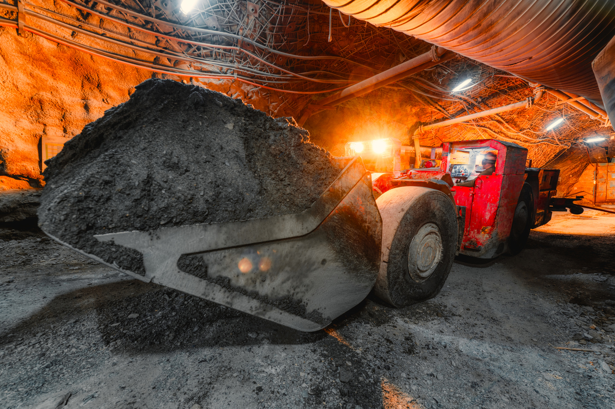 an-underground-loading-machine-carries-a-full-bucket-of-ore-special-low-profile-equipment-for-underground-work